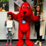 Student and principal with WETA Clifford dog