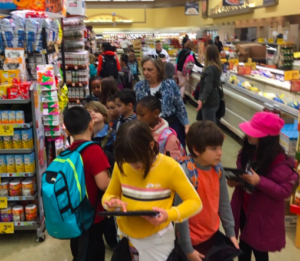2nd graders visit chain grocery store.