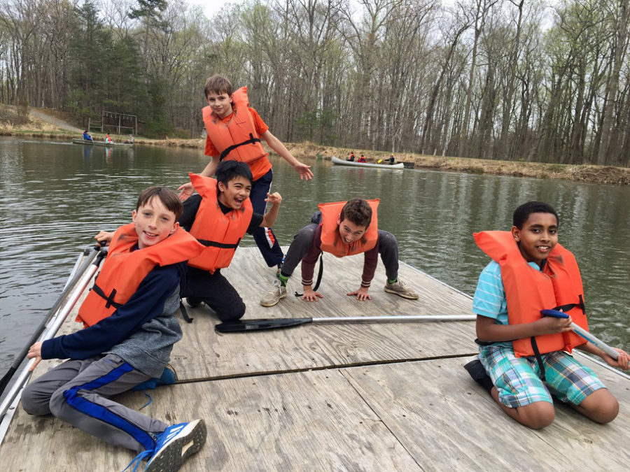 boys on raft at outdoor lab