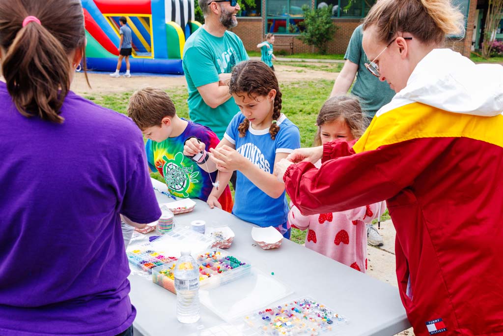 children at beads table
