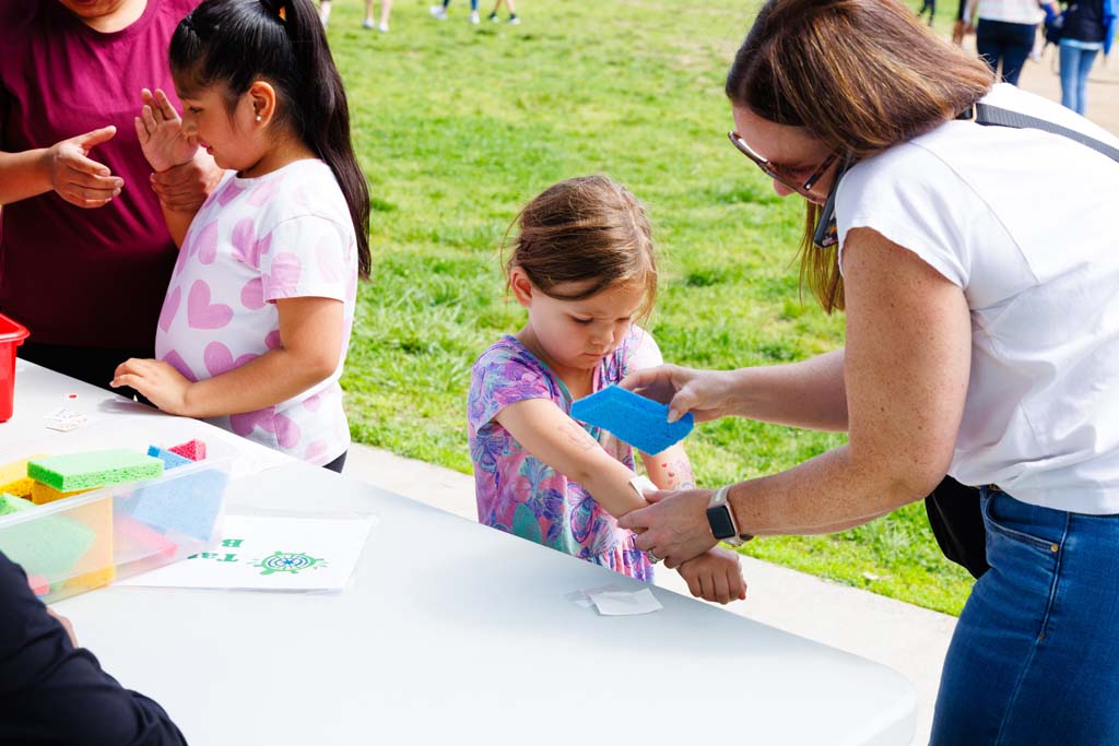 child at removable tattoos table