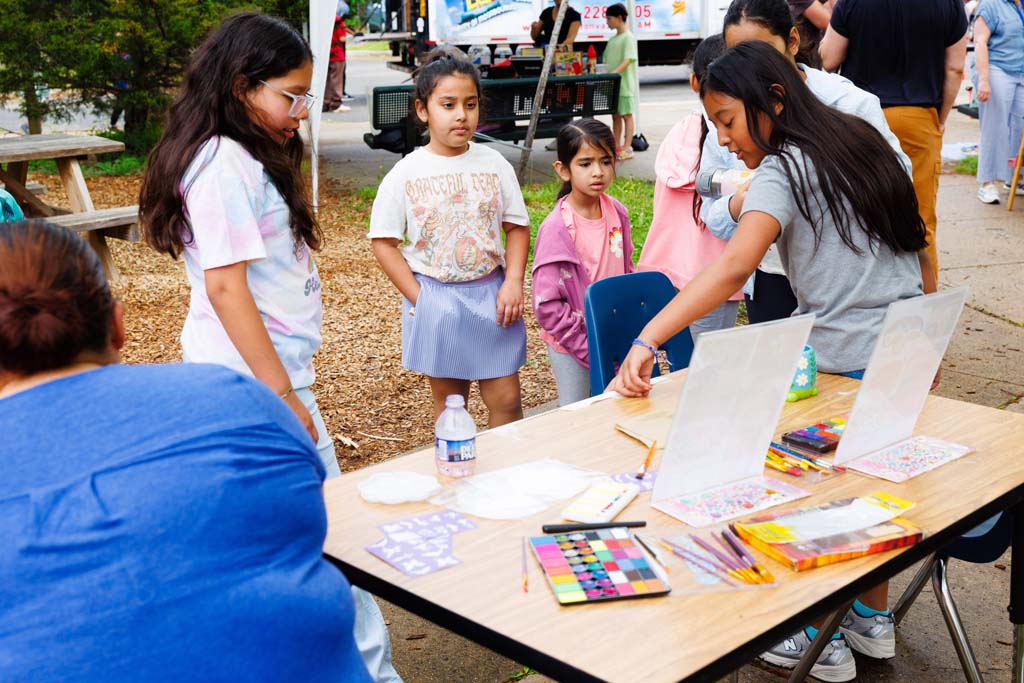 children at face paint table
