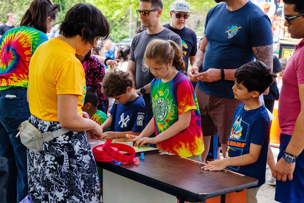 children at raffle table