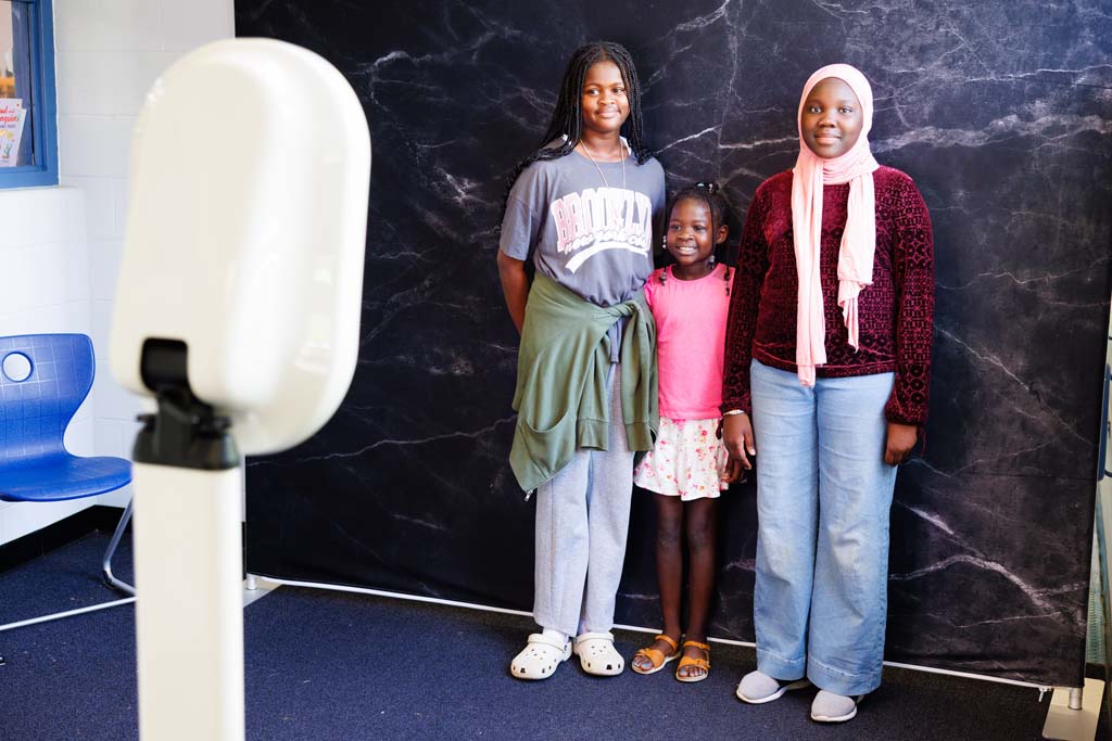 children and parent at photo booth