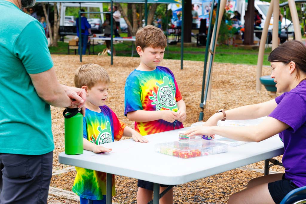 children at beads table