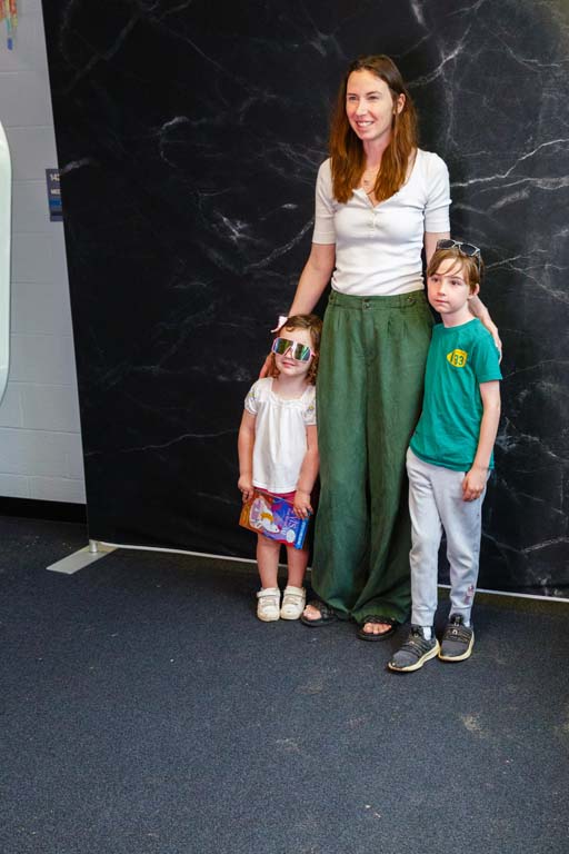 child and parent at photo booth