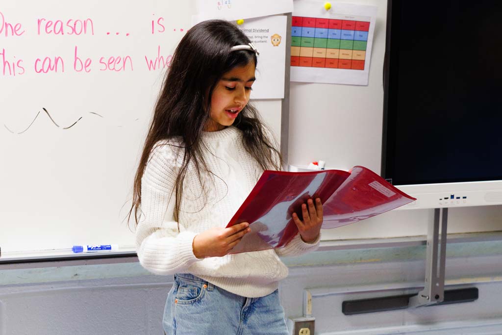 student reading to audience
