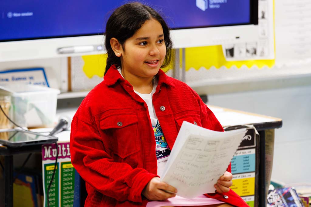 student reading to audience