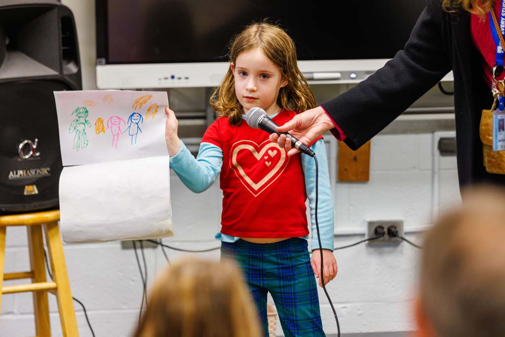 student reading to audience