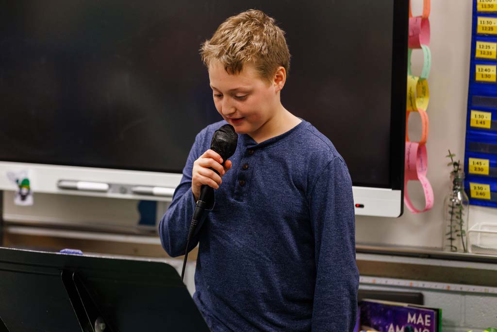 student reading to audience