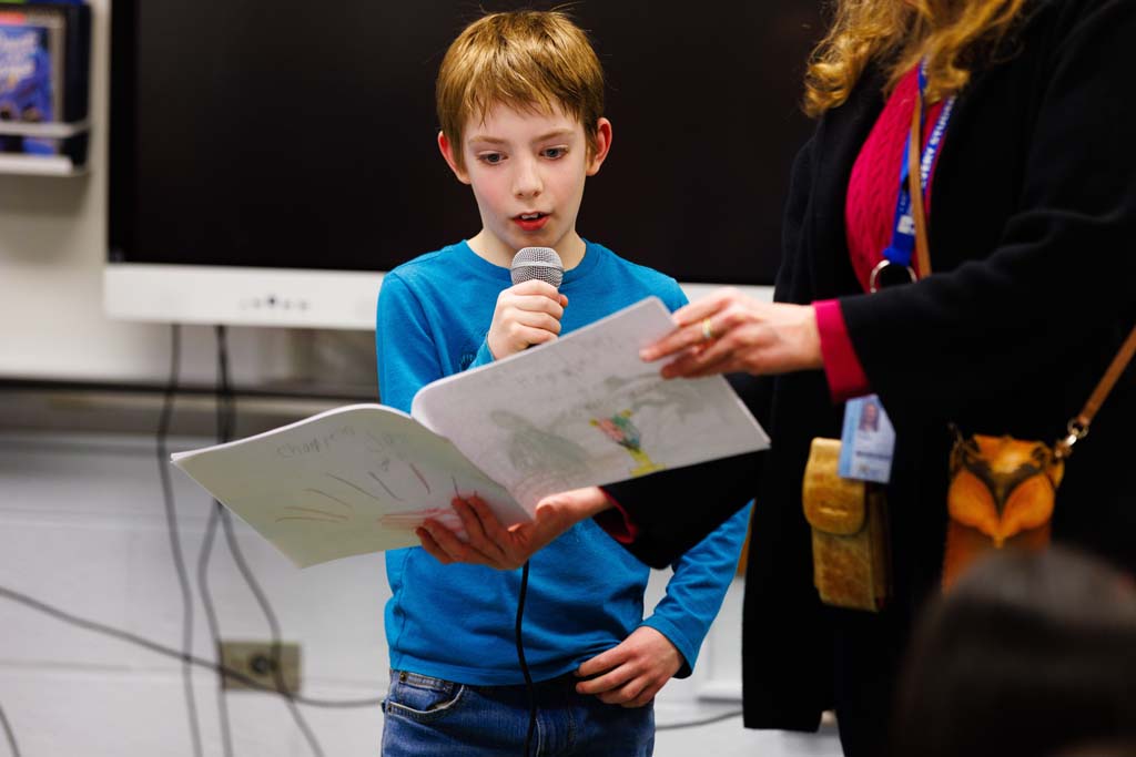 student reading to audience