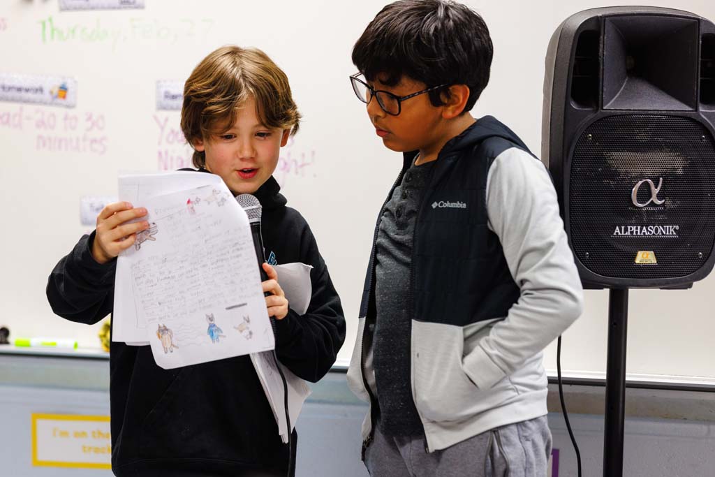 student reading to audience