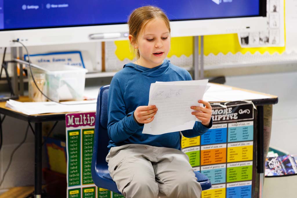 student reading to audience