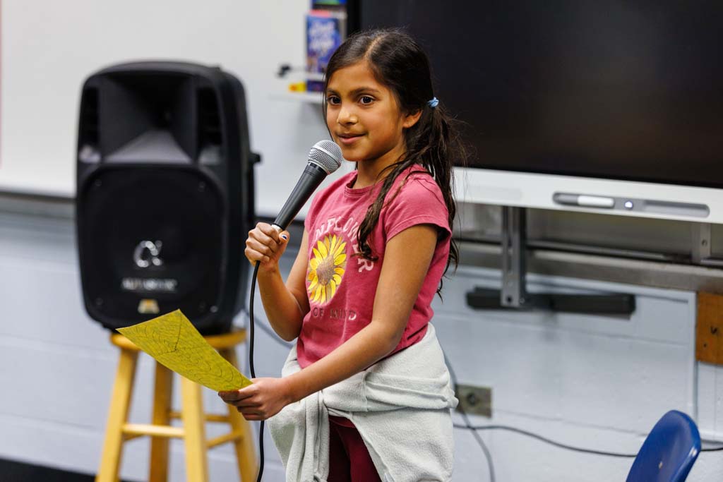 student reading to audience