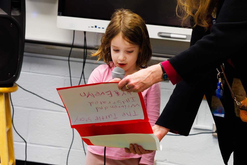 student reading to audience