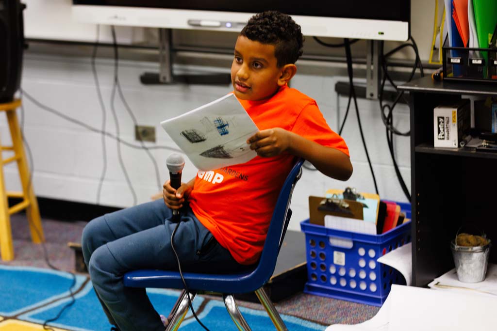 student reading to audience