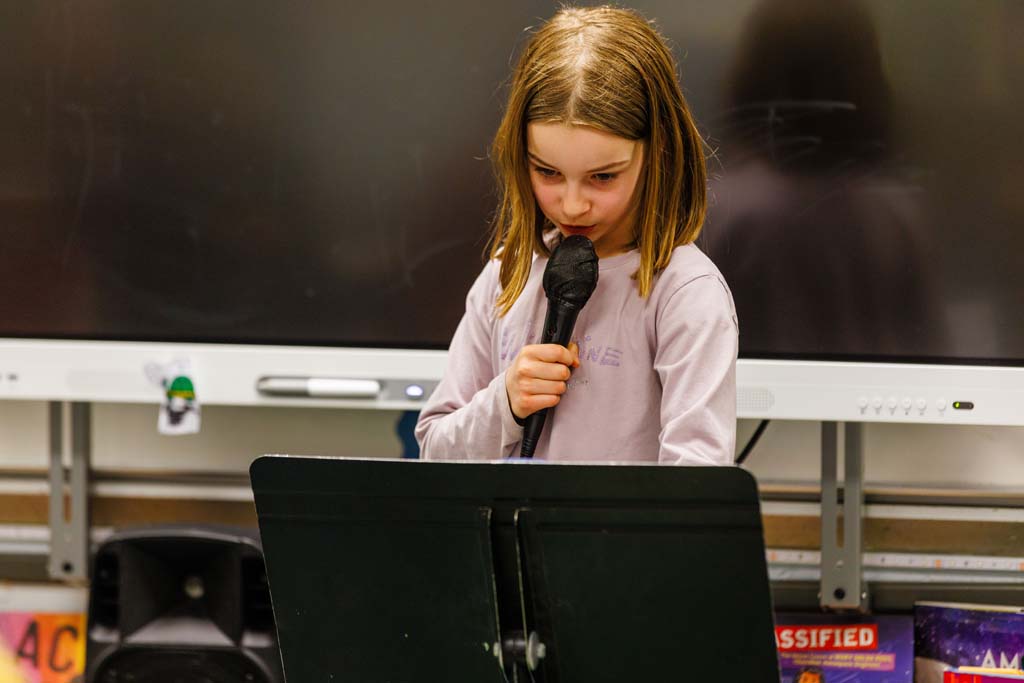 student reading to audience