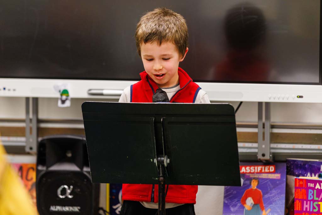 student reading to audience