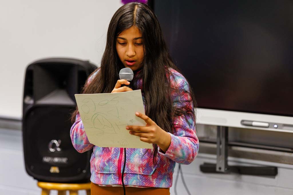 student reading to audience