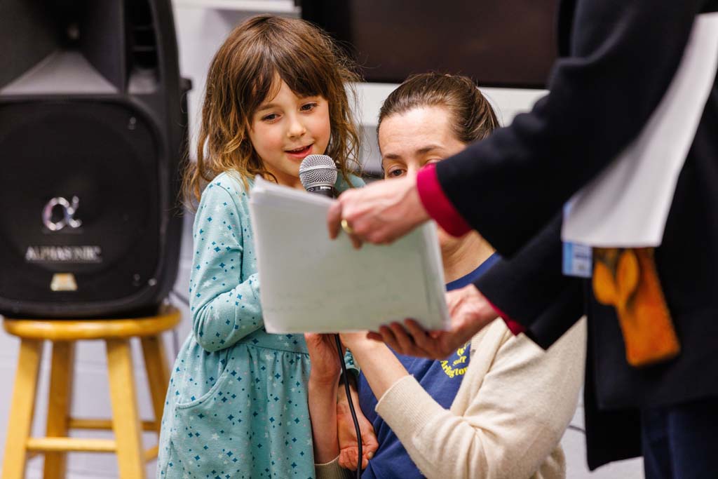 student reading to audience