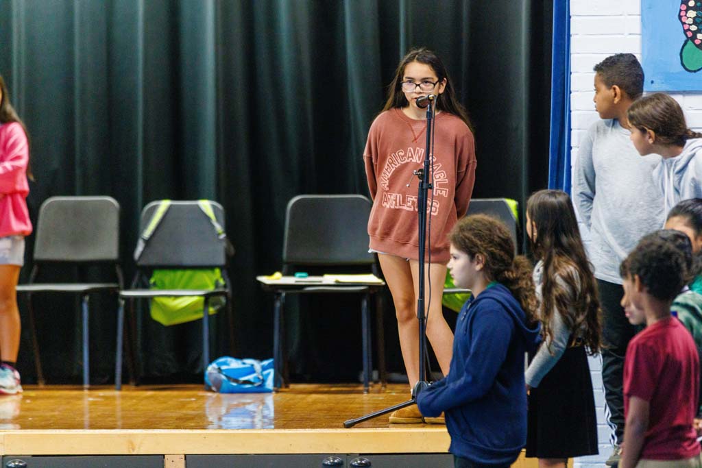 students performing on stage