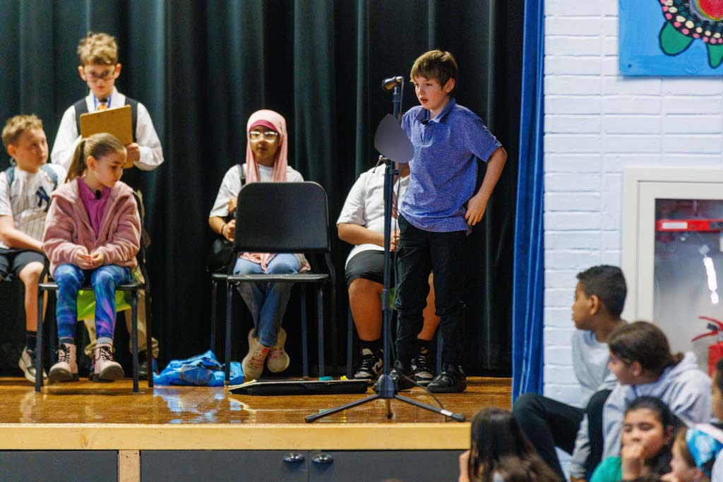 students performing on stage