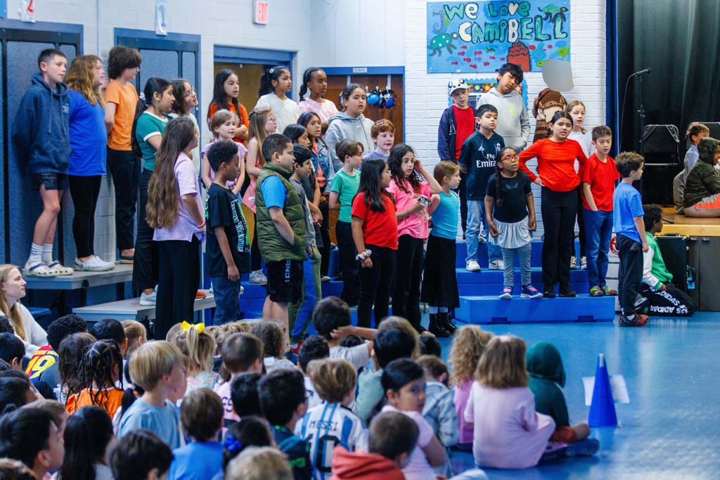 students performing on stage