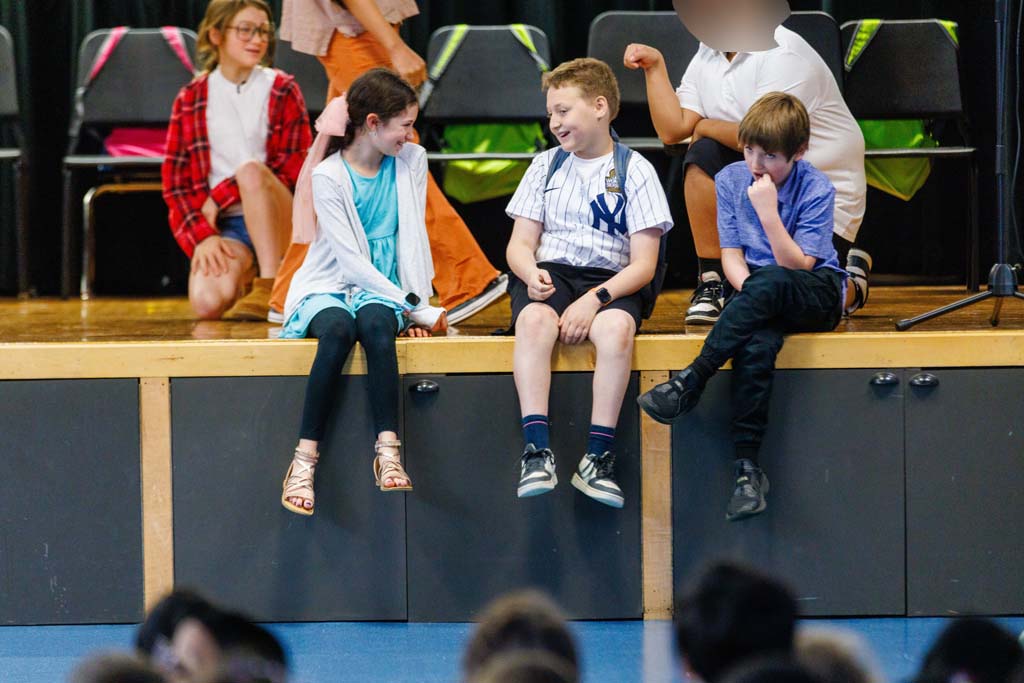 students performing on stage