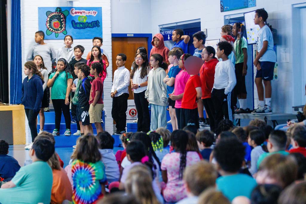 students performing on stage