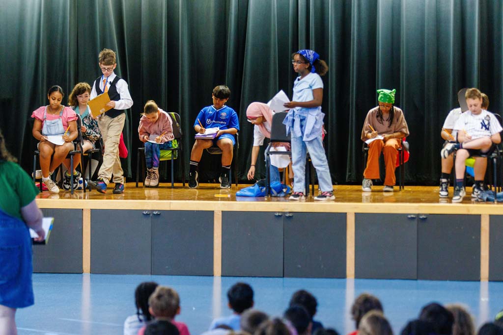 students performing on stage