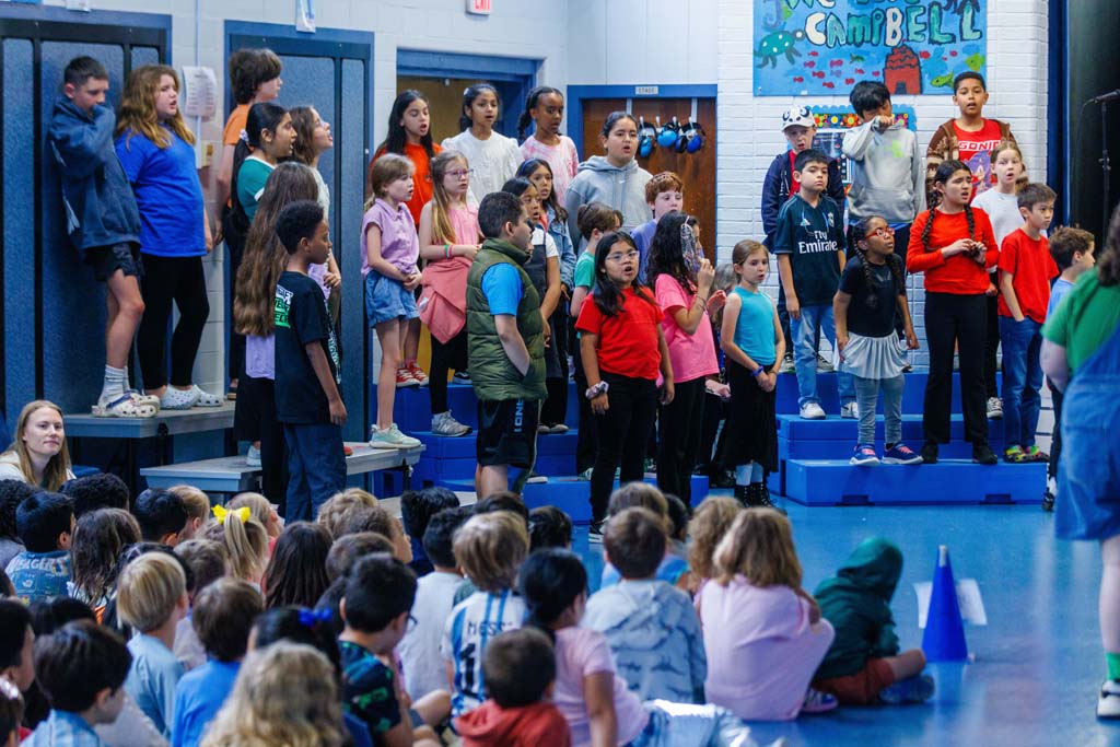 students performing on stage
