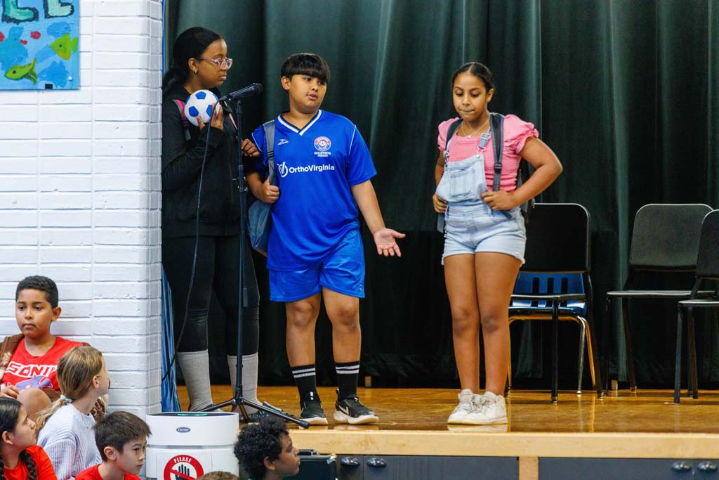 students performing on stage