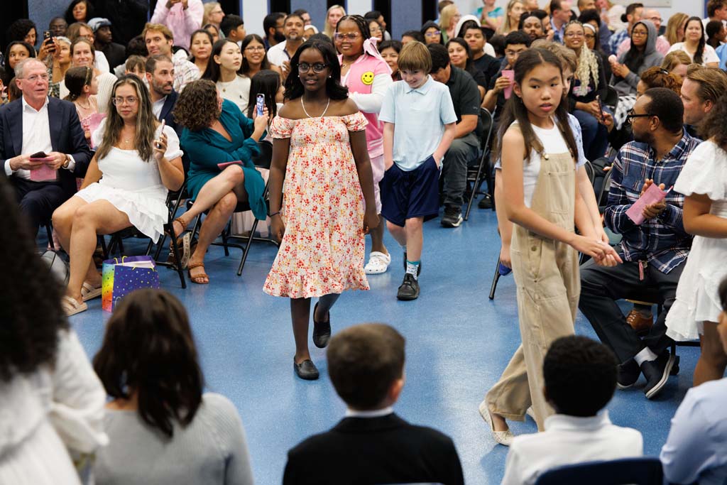 students proceeding into ceremony