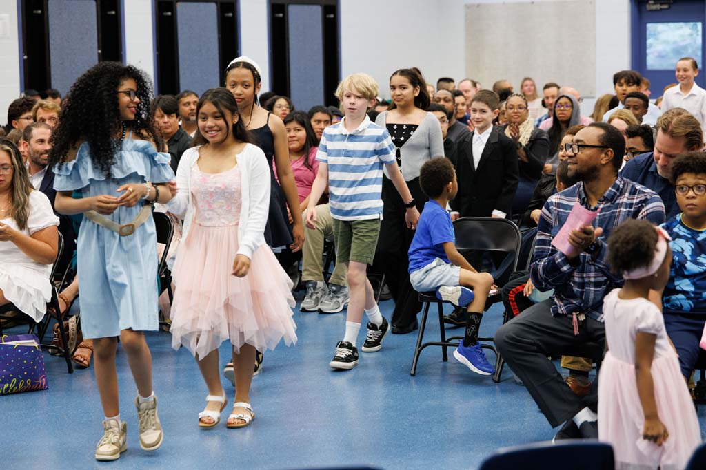 students proceeding into ceremony