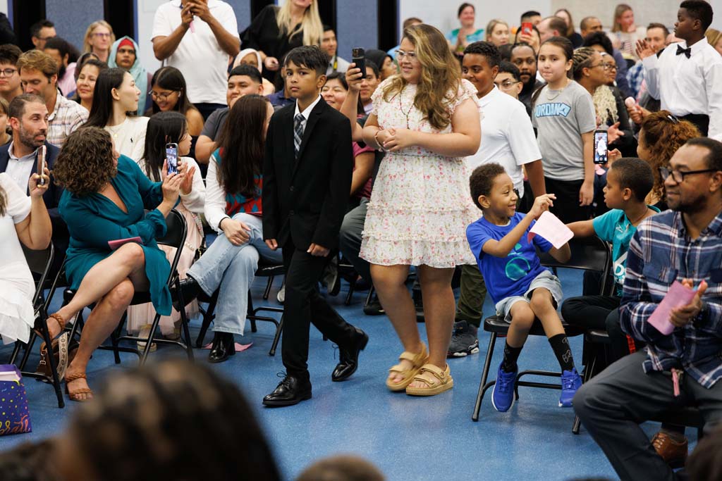 students proceeding into ceremony