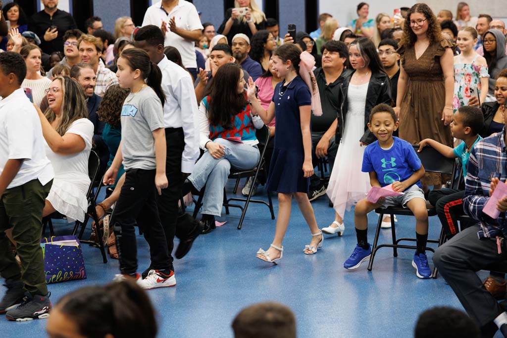 students proceeding into ceremony