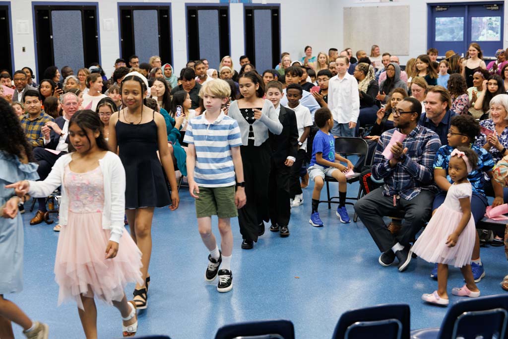 students proceeding into ceremony