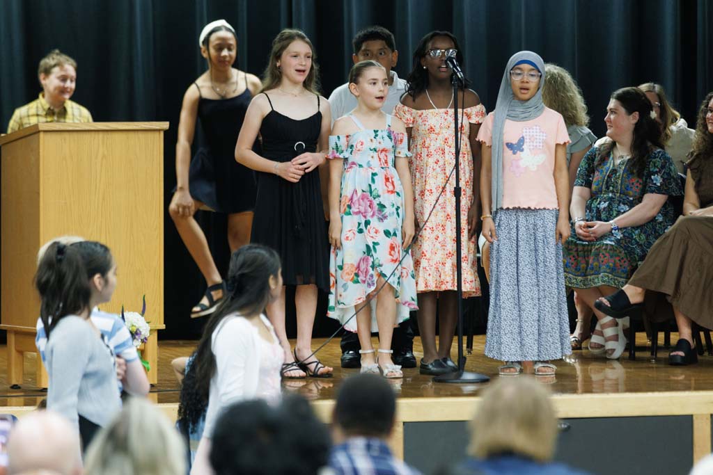 students performing song