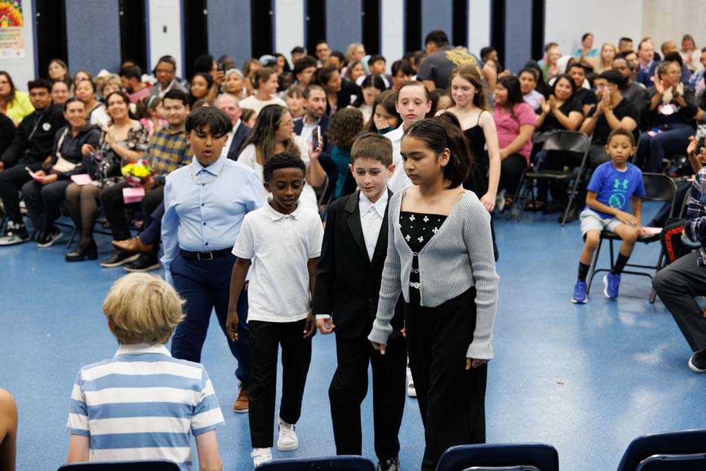 students proceeding into ceremony