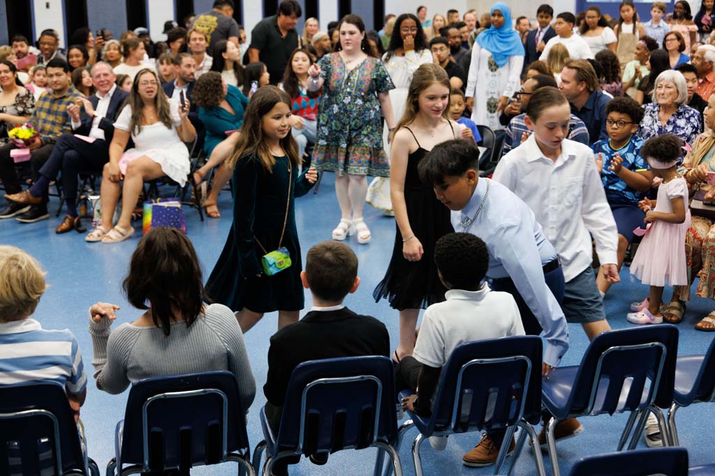 students proceeding into ceremony