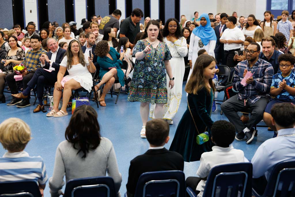 students proceeding into ceremony