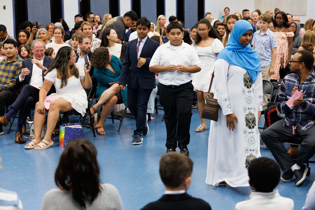 students proceeding into ceremony