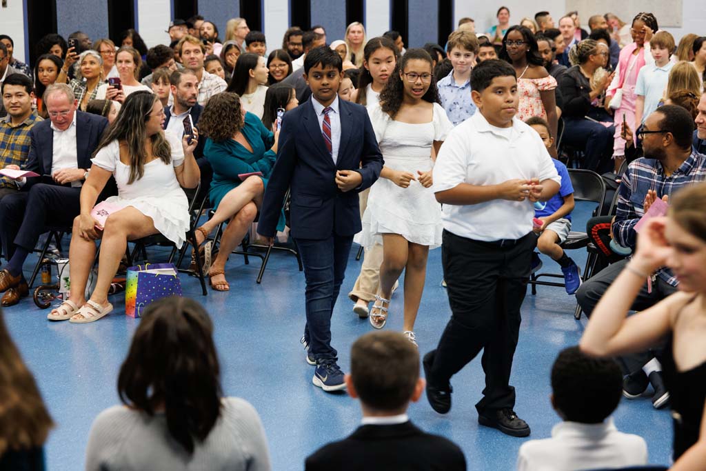 students proceeding into ceremony