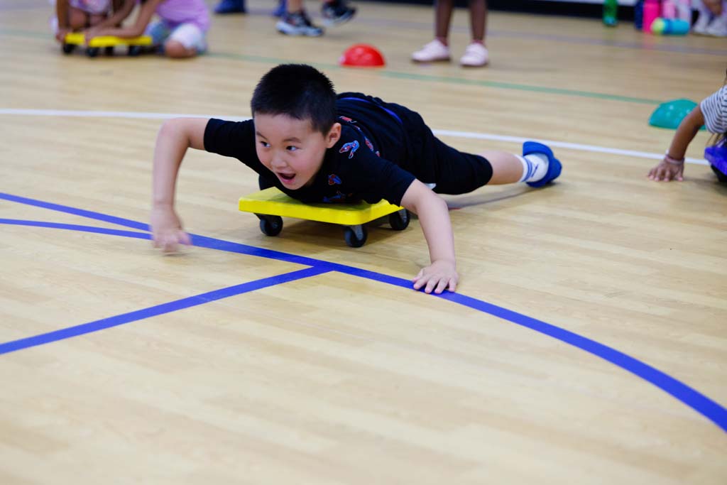 student playing in gym