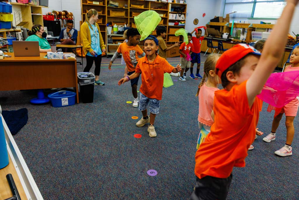 students playing with handkerchiefs