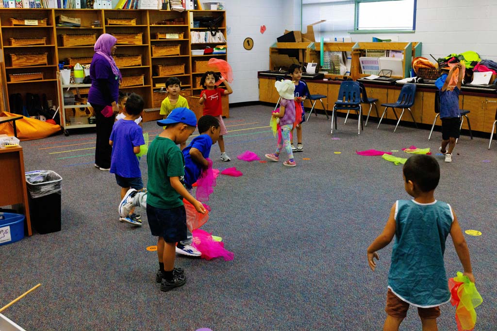 students playing with handkerchiefs