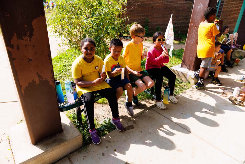 students eating popcicles