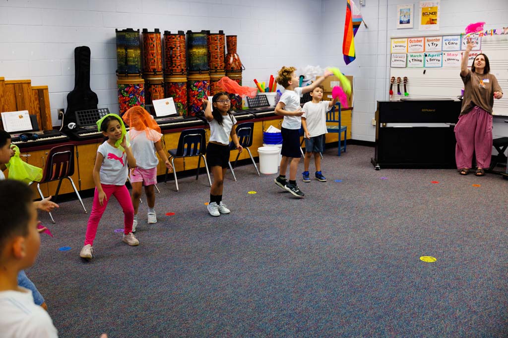 students playing with handkerchiefs