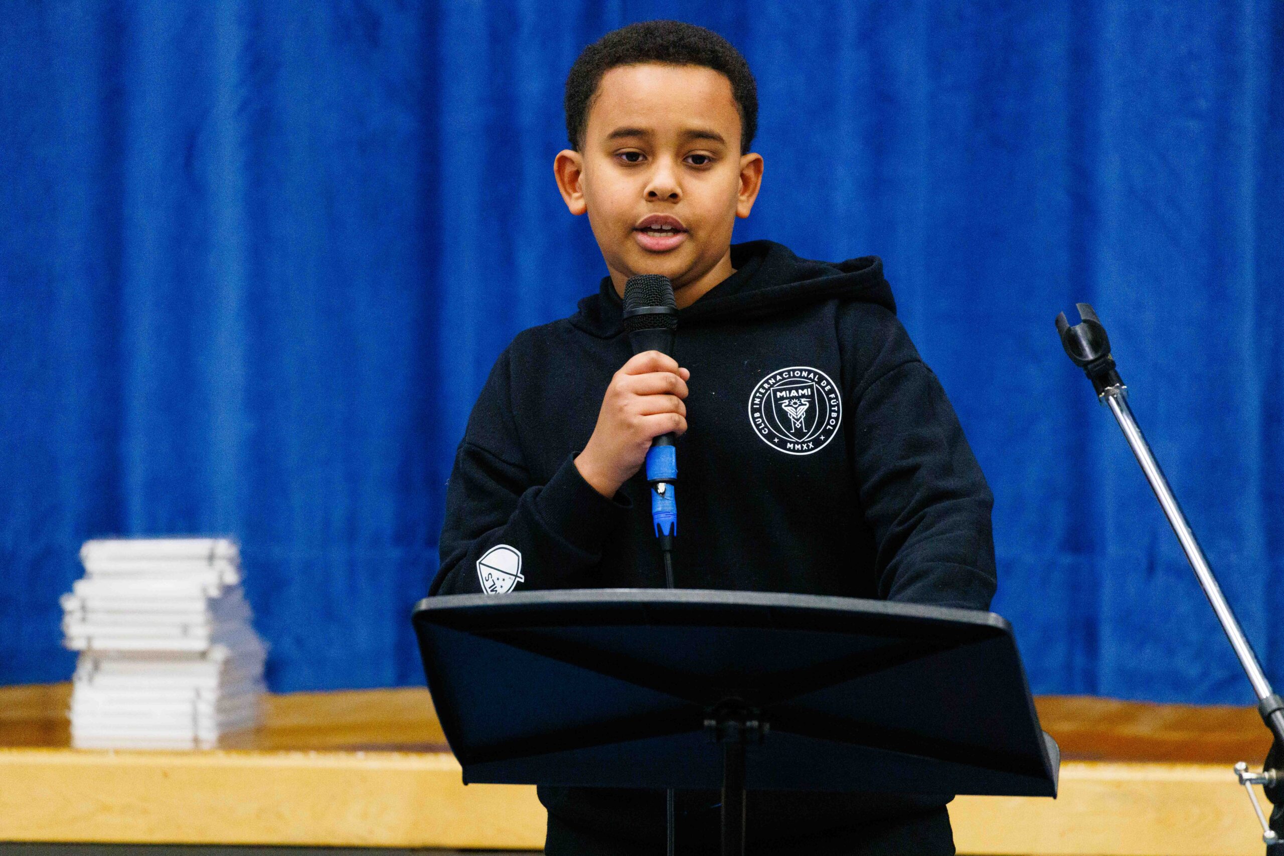 student reciting poetry