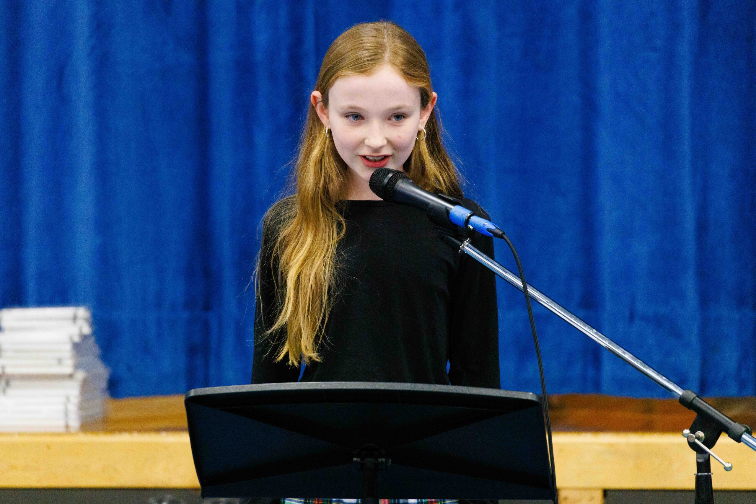 student reciting poetry